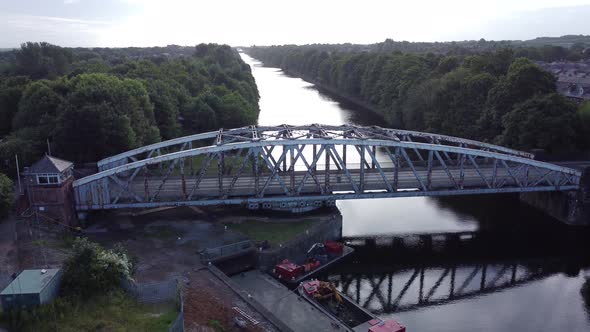 Aerial descending view Manchester ship canal Victorian swing bridge Warrington England