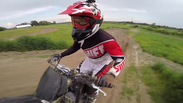 motocross rider giving number one sign in the air over jump selfie gopro slow motion