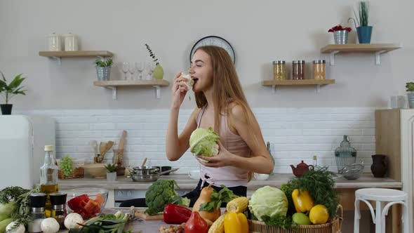 Girl Recommending Eating Raw Vegetable Food. Showing Cauliflower in Hands. Weight Loss, Diet Concept