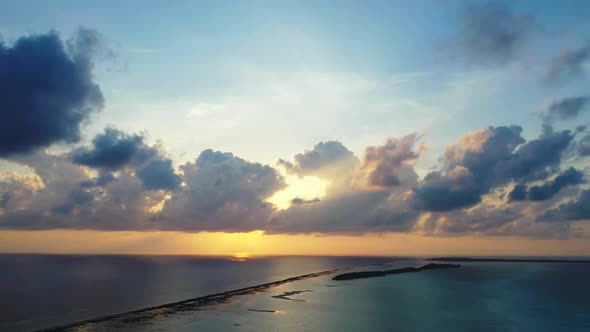 Aerial landscape of perfect island beach voyage by aqua blue ocean and bright sandy background of a 