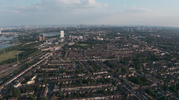 Dolly forward drone shot towards Tottenham hale railway station London skyline