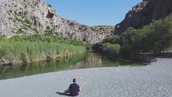 Man flying drone in Preveli Crete