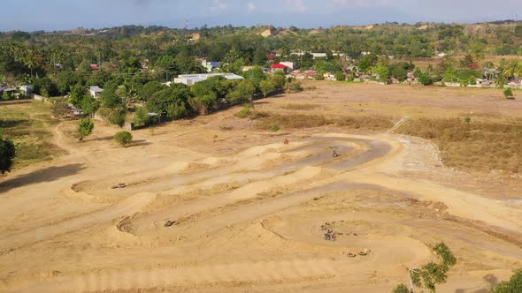 Motorcycle Racers on the Motocross Track