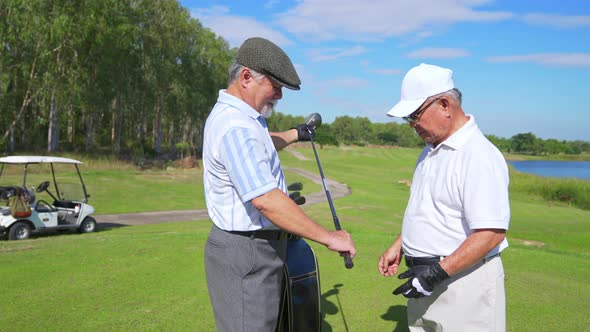 4K Asian senior man friends golfer golfing together on golf course.