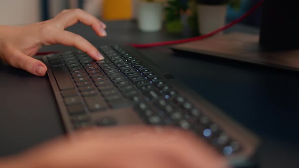 Closeup on Hands of Woman Gamer Playing Video Game