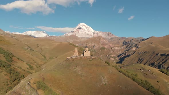 Gergeti Trinity Church in Stepantsminda Mountain Kazbegi at Background Georgia