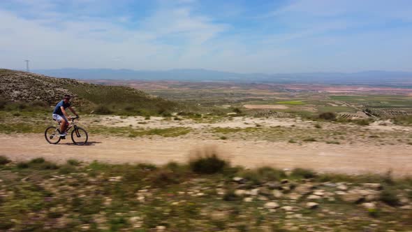 Following A Man On Mountain Bike