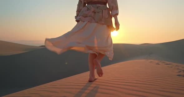 Female Legs with Sunset and Inspirational Nature Landscape on Background