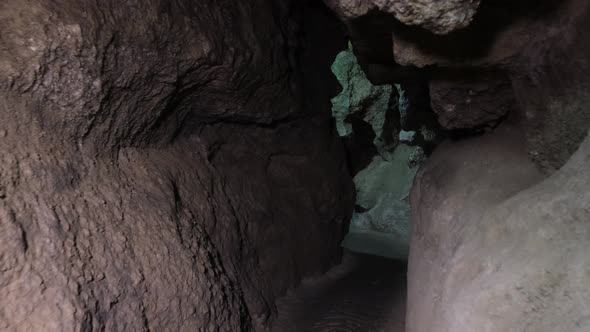 Speleology, cave, dungeon, dark tunnel, underground excavations. The old cave is formed by water