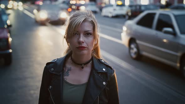 Tattooed Young Lady Hipster in Black Leather Jacket and Choker