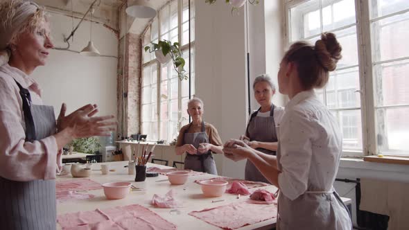 Female Tutor at Ceramic Courses in Workshop