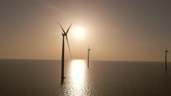 Wind turbines on sea spinning generating energy power from wind, Wind Park. Static shot