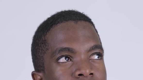 Eyes of Young African Man Thinking and Looking Up