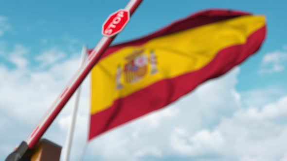 Barrier Gate Being Closed with Flag of Spain As a Background alt
