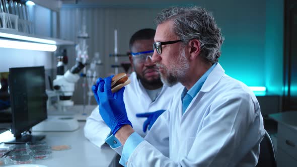 Diverse Scientists Trying Burger with Cell Based Meat