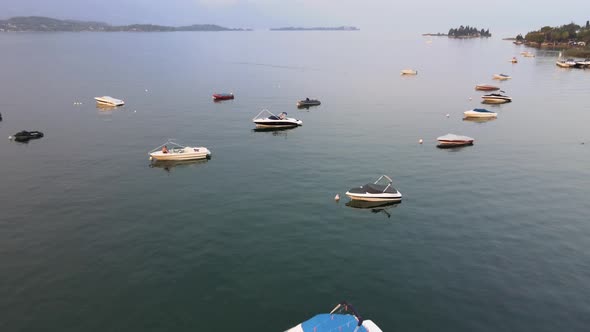 Lago di Garda, Italy. Aerial View of Boats in Calm Water on Sato City Lakefront