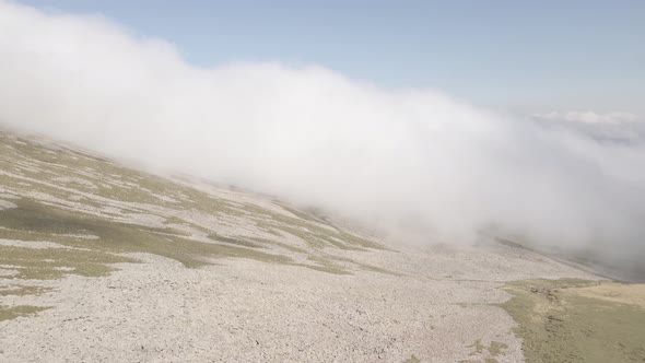 Scenic aerial view of moving white clouds at Abuli Mountain. Georgia