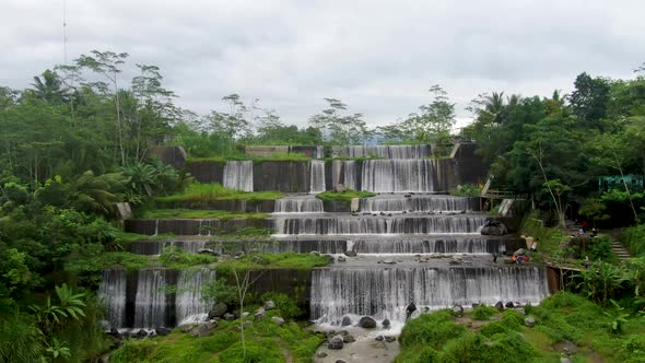 Aerial forward drone view of Watu Purbo waterfall in Muntilan, Indonesia