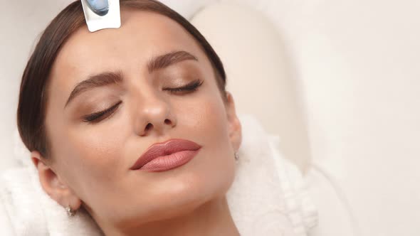 Beautiful Woman with Perfect Skin Having Face Massage