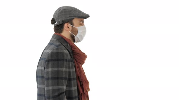 Gentleman Wearing a Protective Face Mask Walking on White Background