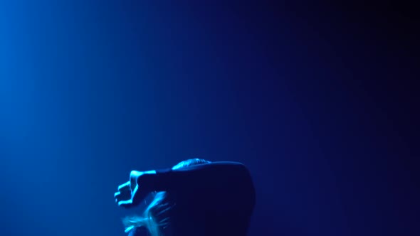 Young Passionate Woman Dances Disdain and Performs Flowing Movements with Her Hands. Close Up