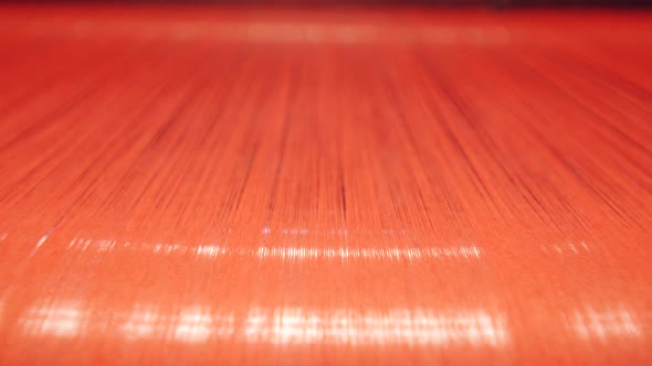 Brightlycoloured Threads on a Metal Roller During Weaving