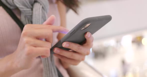 Woman working on smart phone at outdoor