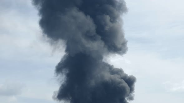 A Giant Fire and a Column of Black Smoke After the Explosion at the Oil Storage