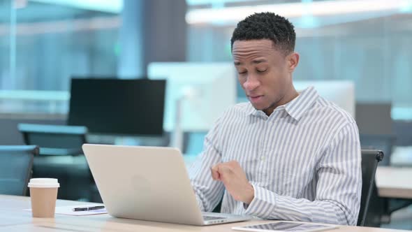 Young African Businessman with Laptop Having Wrist Pain