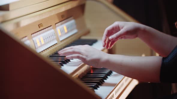 Music Rehearsal  the Hands of Female Organist Play Music in the Church