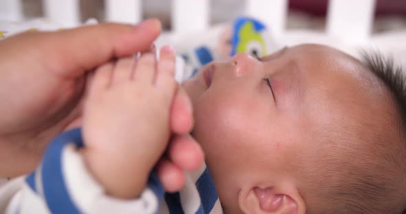 Baby Sleeping While Hold His Mother's Hand