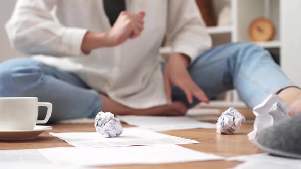 The Girl Is Sitting On The Floor Working Reviewing Studying The Report. The Hand Throws The Paper