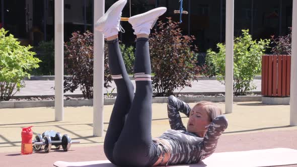 Woman's outdoor workout in summer