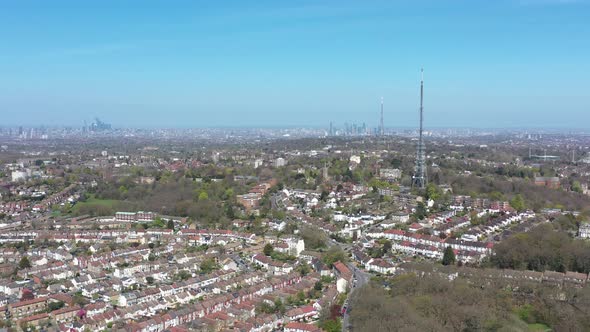 descending drone shot of two antenna in south london Crystal palace tower radio