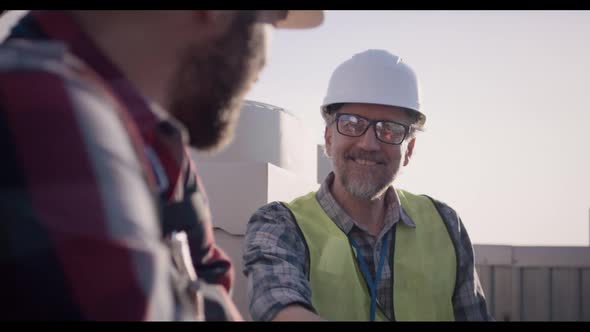 Engineers Having a Break on a Cell Tower