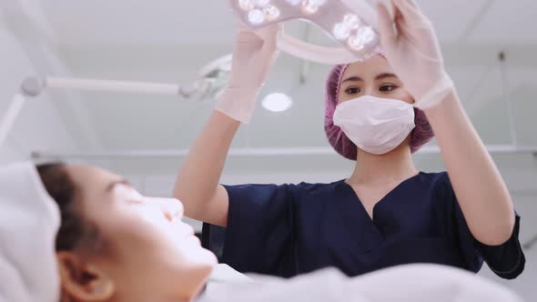 Beauty clinic concept. Young woman getting professional facial procedure.