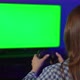 A Young Woman is Playing a Game Console - VideoHive Item for Sale
