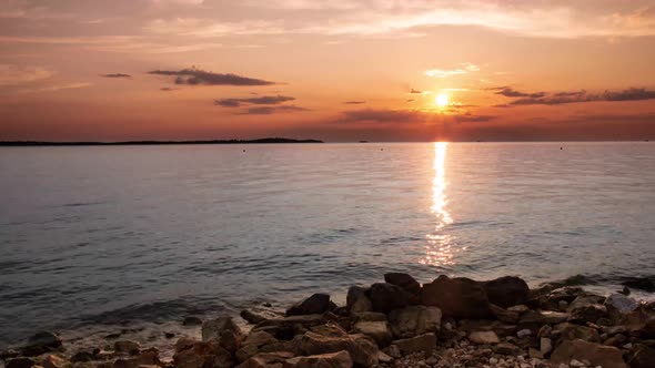 Wide timelapse of a sunset on Croatian beach