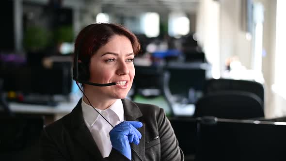 Portrait of a Friendly Female Call Center Operator