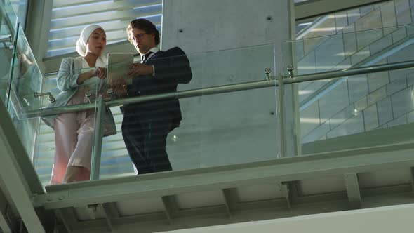 Young business people talking in a modern office