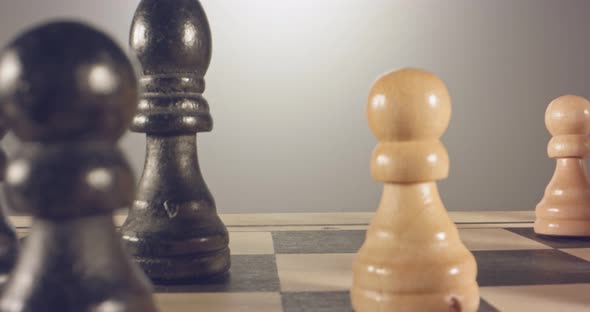 Special tracking macro shot moving between chess pieces on a chess board