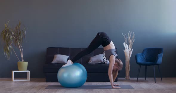 Motivated Woman Practicing Fitball Pike Push-ups at Home