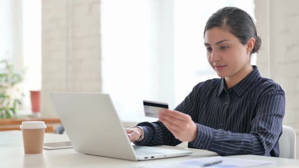 Young Indian Woman Having Online Payment Success on Laptop