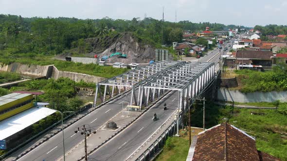 Iron construction of Kaliputih bridge in Muntilan, Indonesia, aerial arc shot