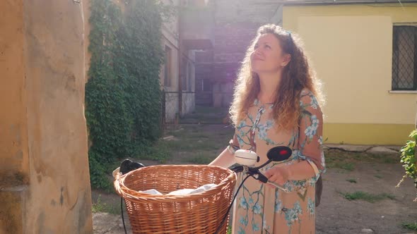 Portrait Young Smiling Woman Curly Red Hair Standing Vintage Bike Old European Courtyard