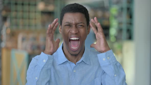 Angry Young African Man Shouting, Screaming