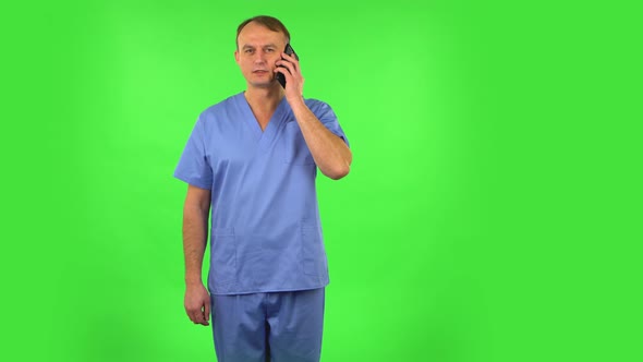 Medical Man Talking for Mobile Phone and Rejoice. Green Screen