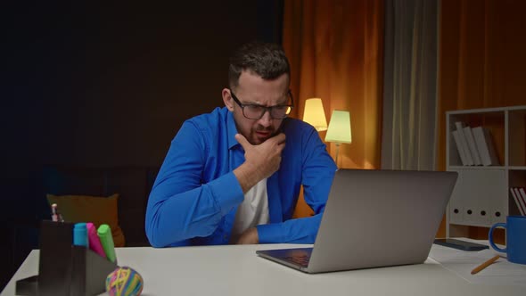 Thoughtful Business Man Thinking of Problem Solution Working on Laptop