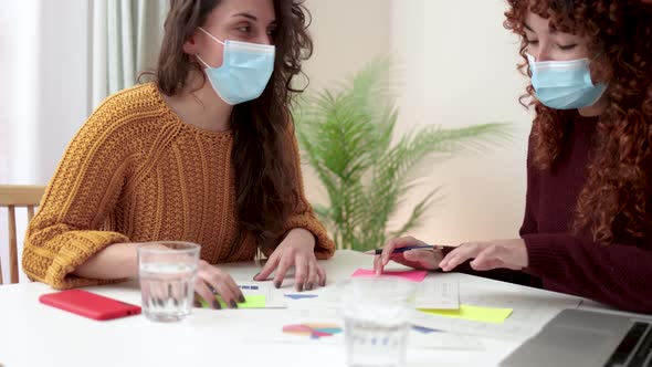 Young Business People Working Inside Modern Office Wearing Protective Masks During Coronavirus