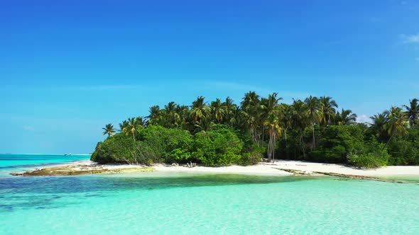 Aerial tourism of exotic coast beach lifestyle by shallow ocean with clean sandy background of a pic